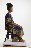  Dina Moses  1 dressed sitting traditional decora long african dress whole body 0005.jpg